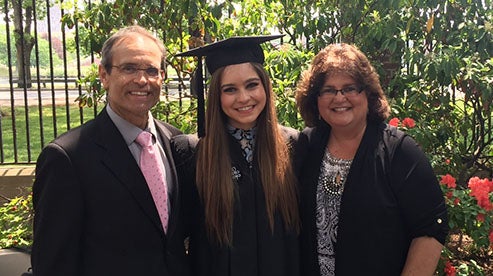 Alexandria Campbell Kalina AB '82 with her daughter, Maria AB '16, and husband, Paul, on Commencement Day at Harvard.