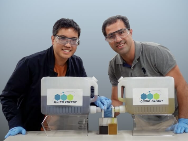 Quino Energy co-founders Eugene Beh and Meisam Bahari, a former postdoctoral researcher at SEAS, posing with containers filled with their solution