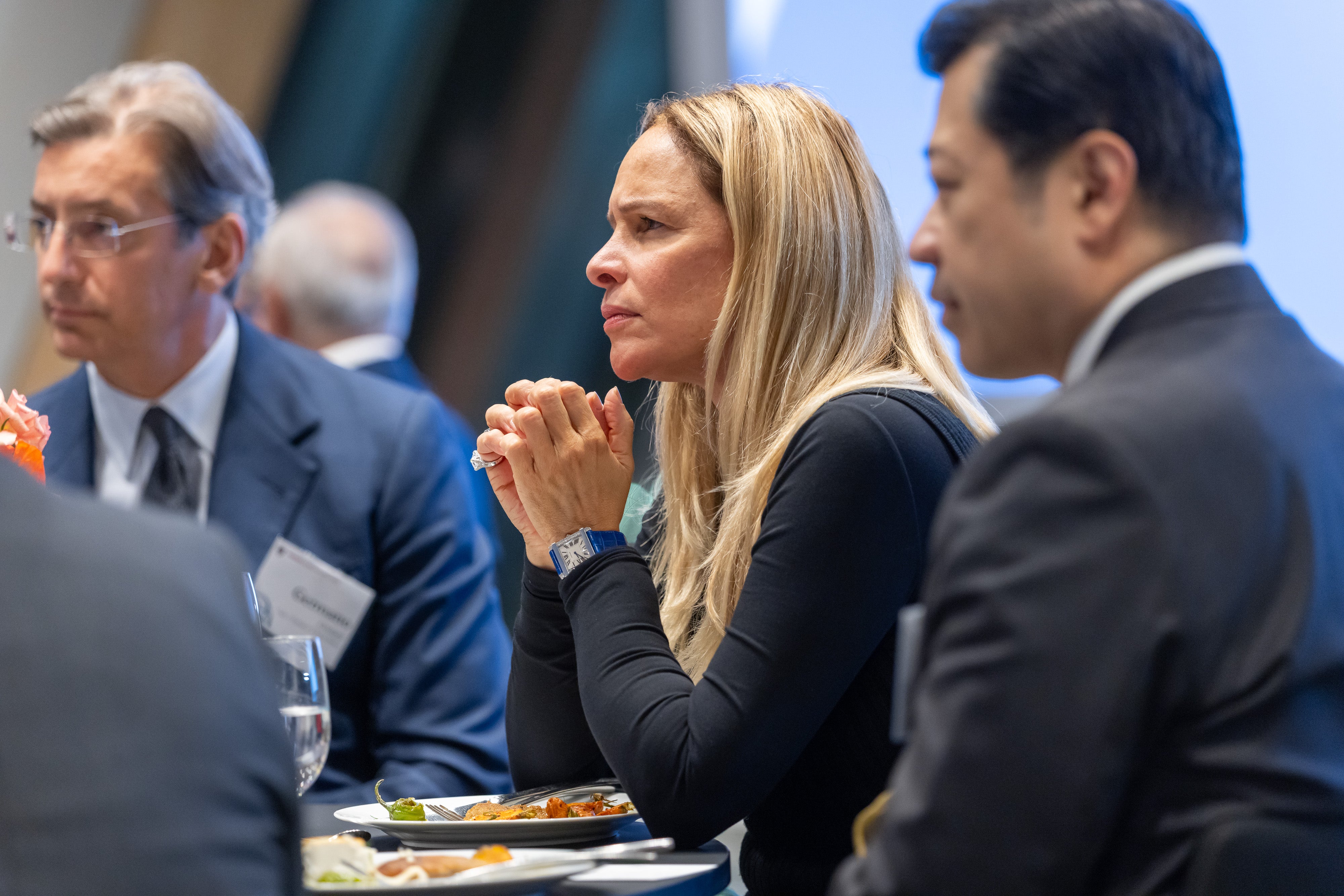Mario Germano Giuliani, Luciana de Oliveira Cezar Coelho, and Suphachai Chearavanont speak with fellow attendees over dinner at the 2025 Global Advisory Council meeting.