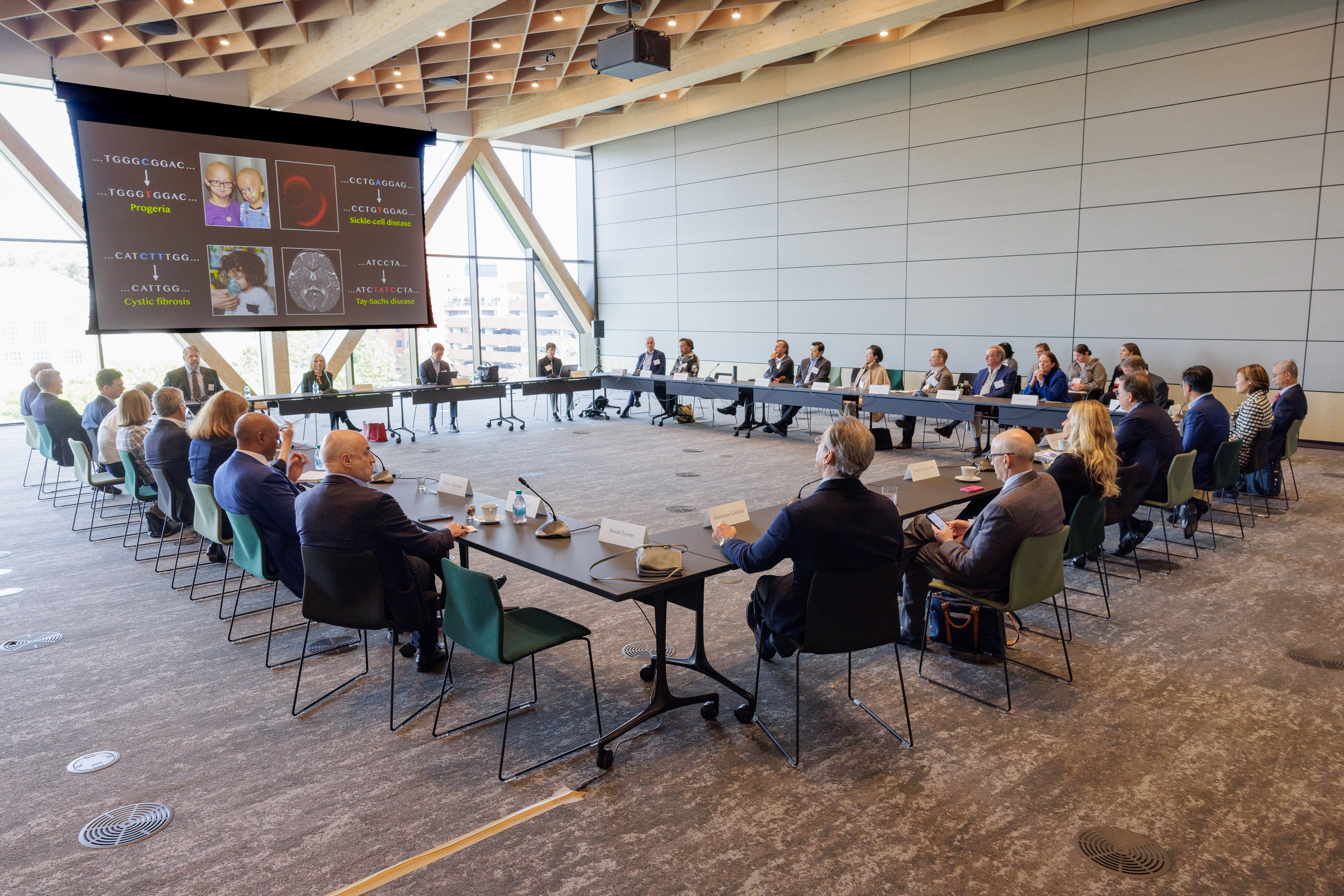 Wide shot of Harvard faculty members presenting at the 2025 Global Advisory Council meeting.