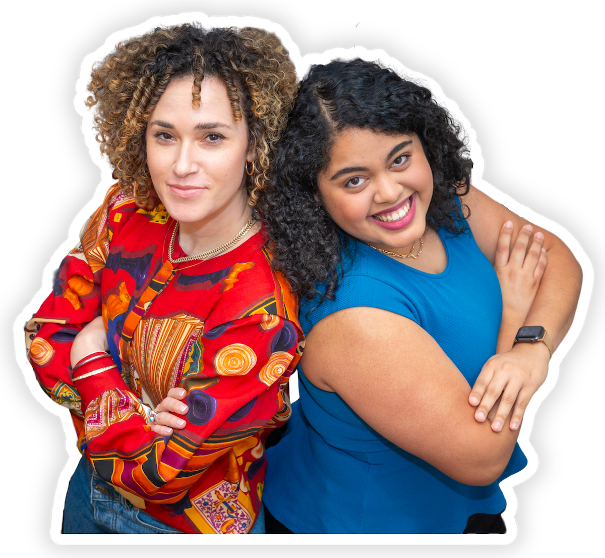 Two graduates of HGSE master’s program stand back-to-back and smile.