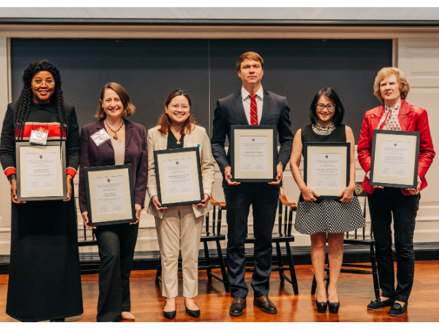 Ngozi Okose ALM '18 accepts award on behalf of Louis Edozien AB '81, Marie-Christine Nizzi AM '16, PHD '20, GSAVF '21, Criselle Penamante MMS '25, HMSEE '21 holds award for Oghenerume Aggreh LLM '85, Kostiantyn Lisnychi HBS Exec Ed '21, Veronica Wong AB '88, HLS '96, and Kathleen Henschel AB '79 accepts award on behalf of Alice Abarbanel AB ’66