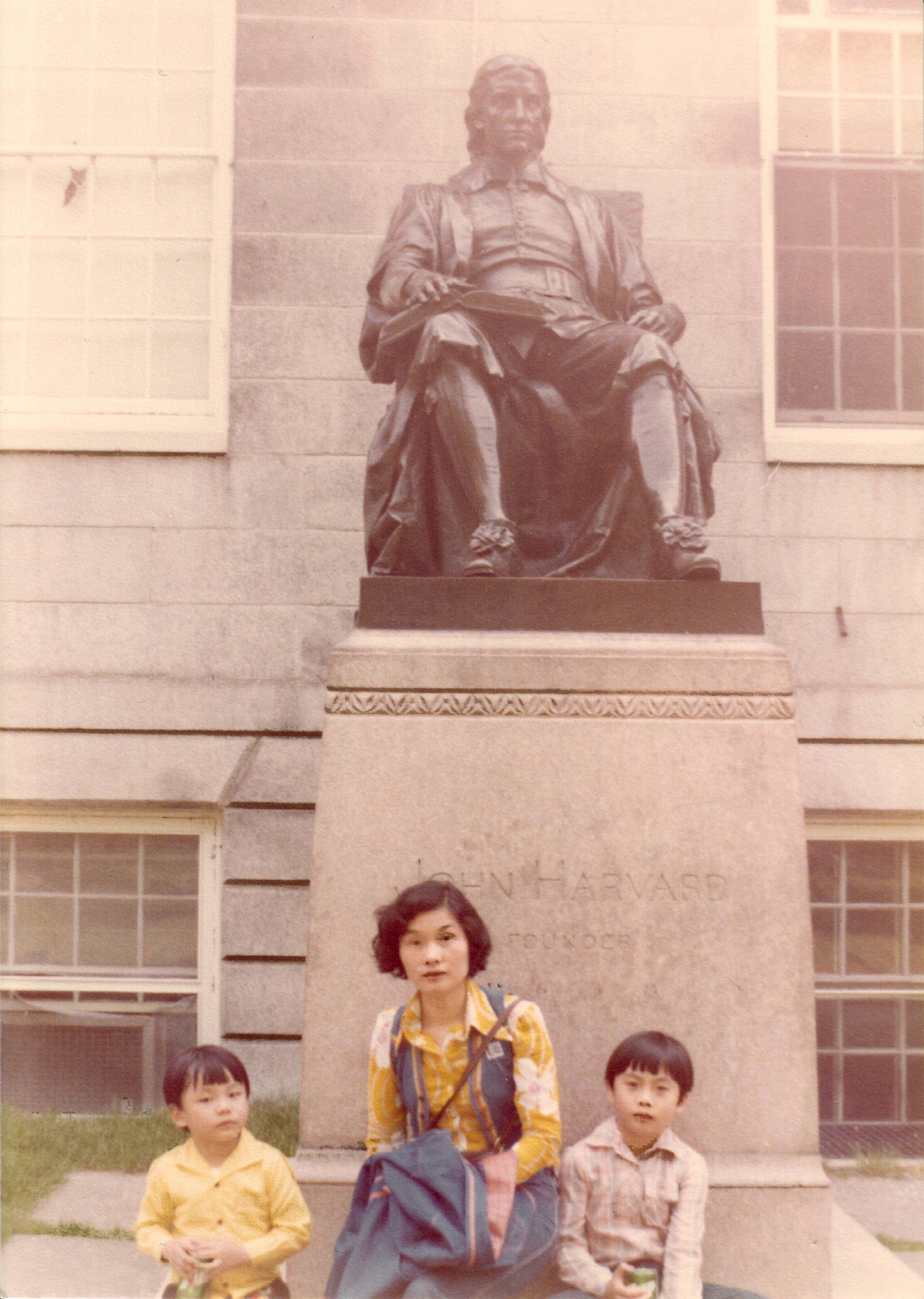 Edwin Lin '97 with his mother, Shu-Nuan Lin, and his brother, Alfred '94, in front of the John Harvard statue