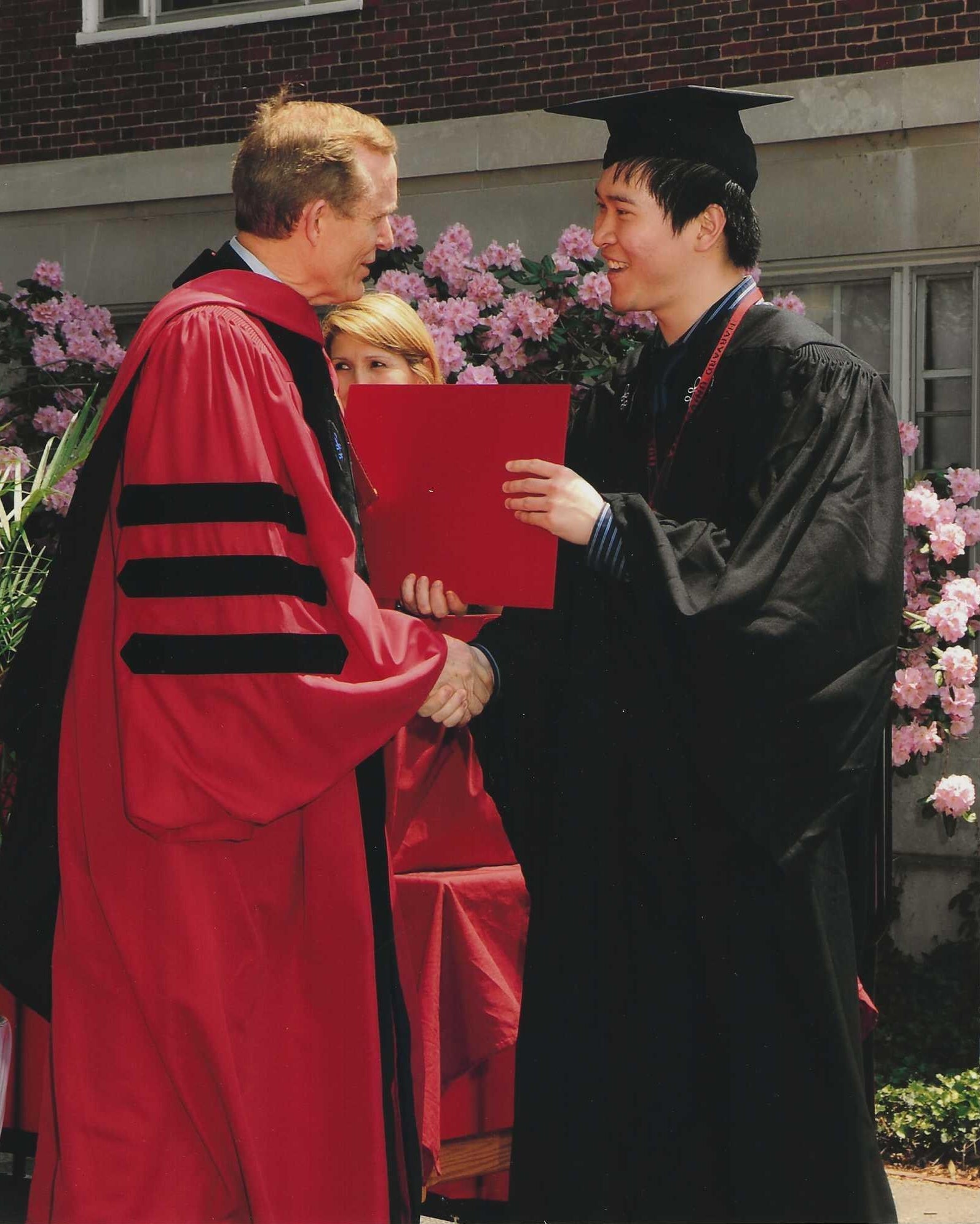 Han receiving his Harvard degree in 2011