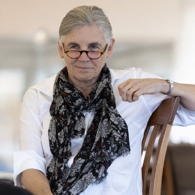 Kathy Burke sitting looking at the camera