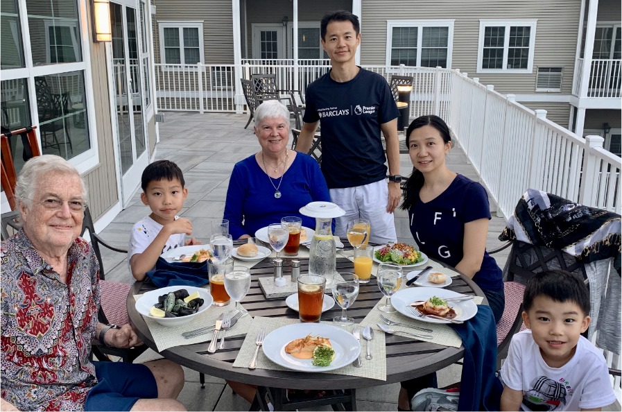 Max AB ’04, MBA ’08, JD ’10 and Maggie Chen (right), along with their sons Mickey and Marshall, share a meal with Dan AB ’64 and Joyce AB ’65 Curll