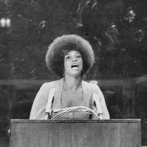 Woman speaking at a podium