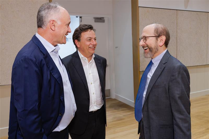 President Alan M. Garber speaks with Charles Emmitt Ryan and Martin E. Escobari during the welcome reception at the 2025 Global Advisory Council meeting.