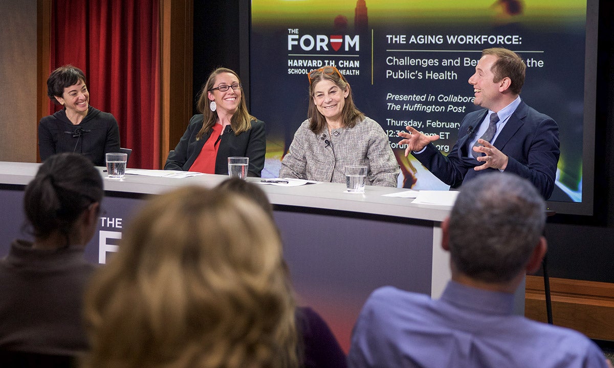 A panel of epidemiology faculty and students speak to an audience