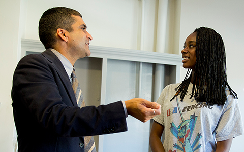 Harvard College Dean Rakesh Khurana greets MacKenzie Lawrence ’18