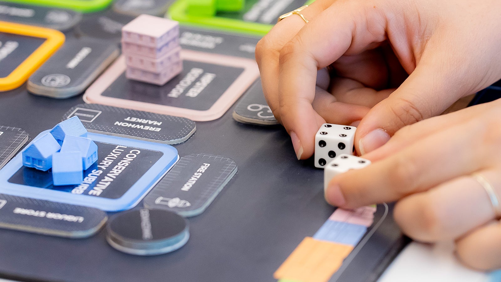 A photo showcasing a boardgame centered on housing production in Los Angeles, created by students at Harvard Graduate School of Design