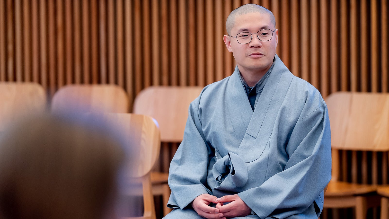 Venerable Deung Myoung Sunim leads a group meditation inside the Harvard Divinity School’s multifaith space