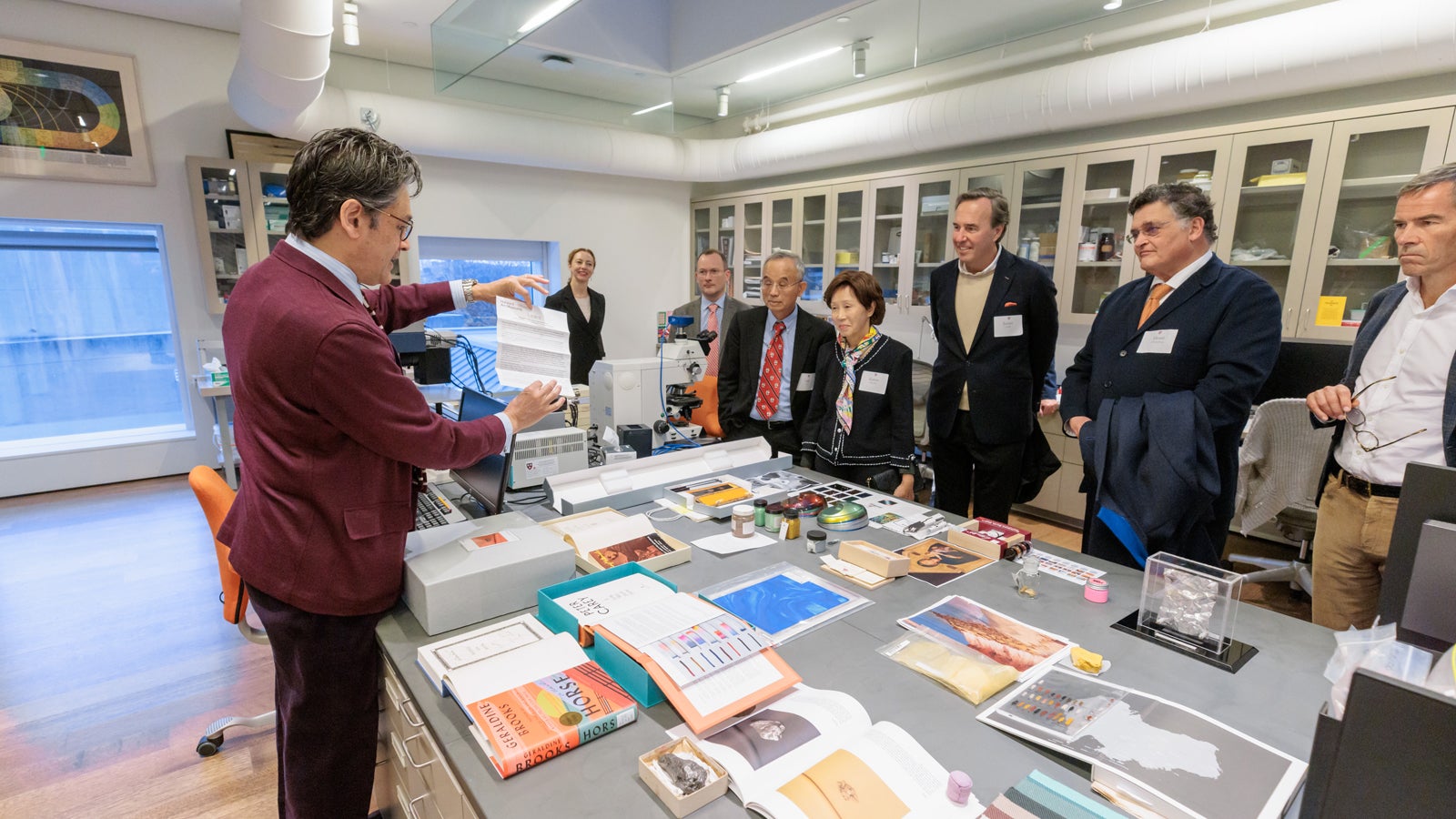 Global Advisory Council members taking a behind-the-scenes tour of the Straus Center for Conservation and Technical Studies.