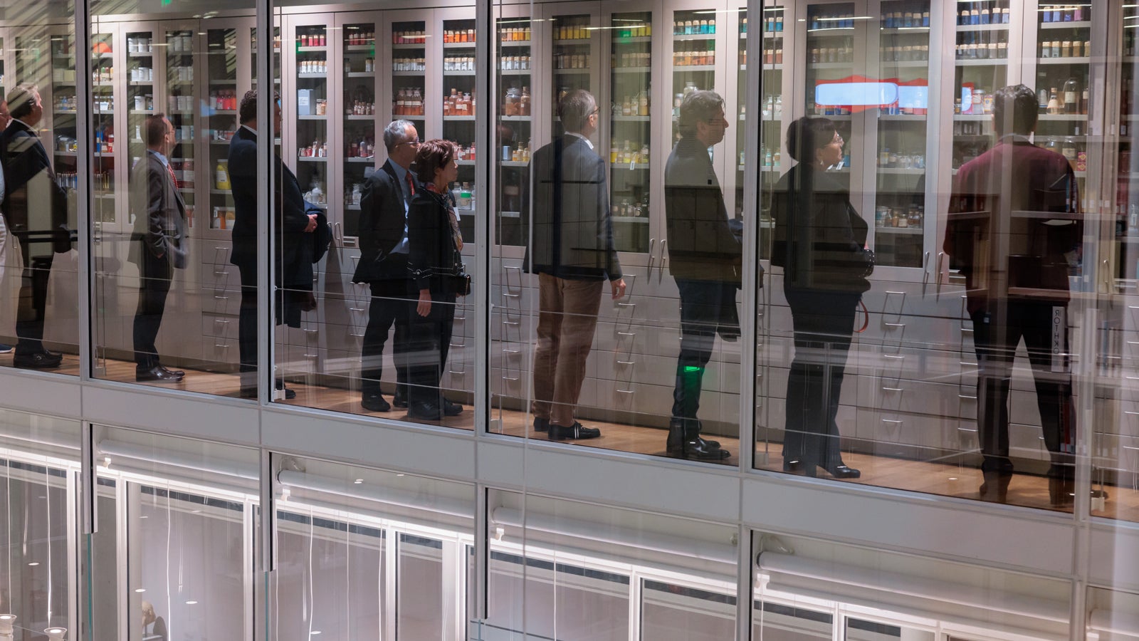 Global Advisory Council members getting an up-close look at the renowned Forbes Pigment Collection at the Harvard Art Museums.