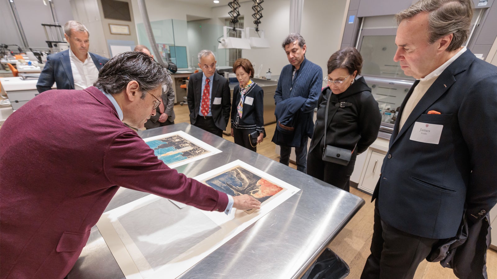 Global Advisory Council members examining recently conserved prints by Edvard Munch from the Harvard Art Museums’ collection.