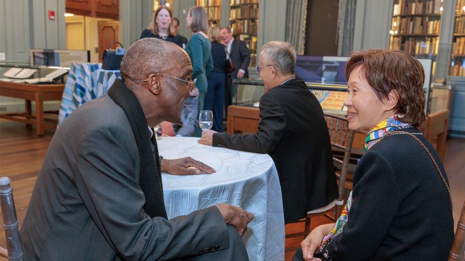 Keem I. Belo-Osagie MBA ’80 and Karen Shu-Mei in conversation during a welcome reception at the 2024 Global Advisory Council meeting.