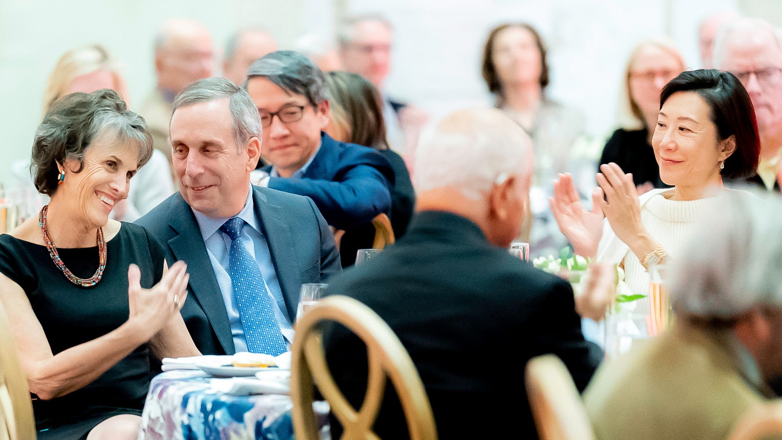 President Lawrence Bacow JD '76, MPP '76, PhD '78 and Adele Bacow listen to remarks during the COUR reception at the Harvard Art Museums