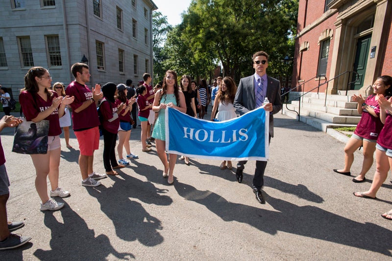 Students cheer on the Hollis freshmen. 