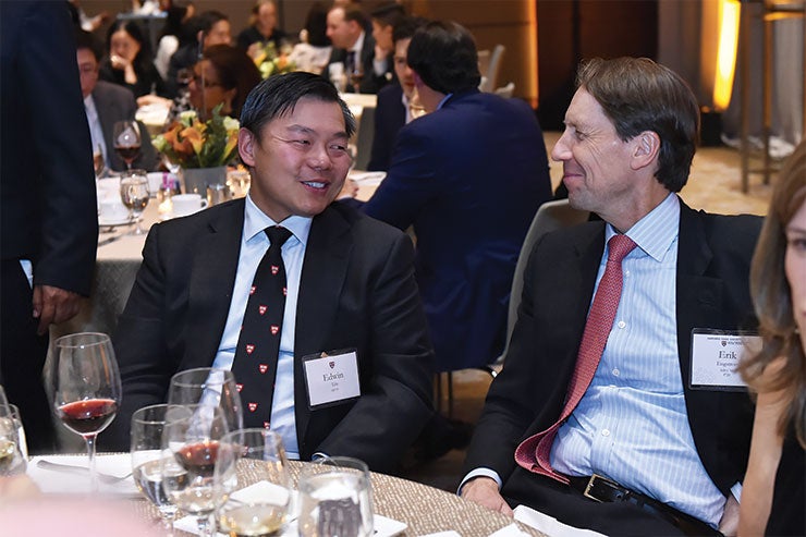 Guests chat at the President's Associates Dinner in 2019