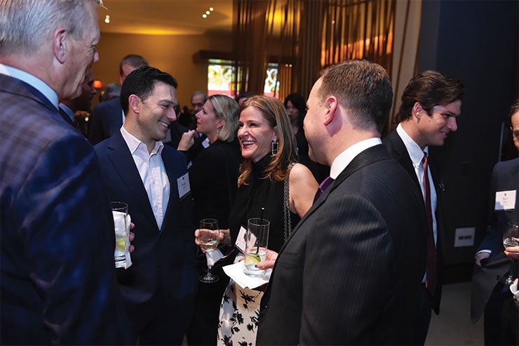 Guests chat at the President's Associates Dinner in 2019