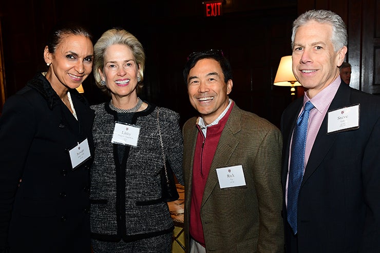 Four guests pose for a picture