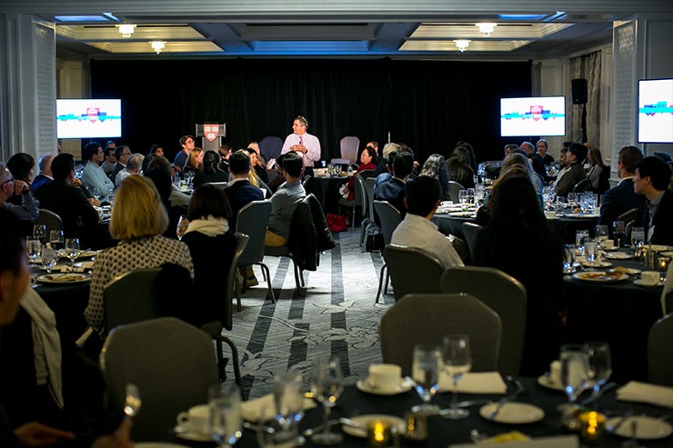 Guests engage with Rakesh Khurana during his presentation