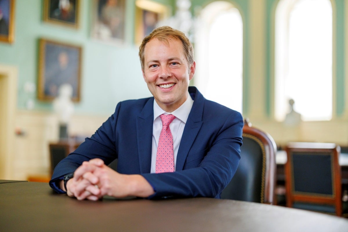 David Deming sitting in University Hall