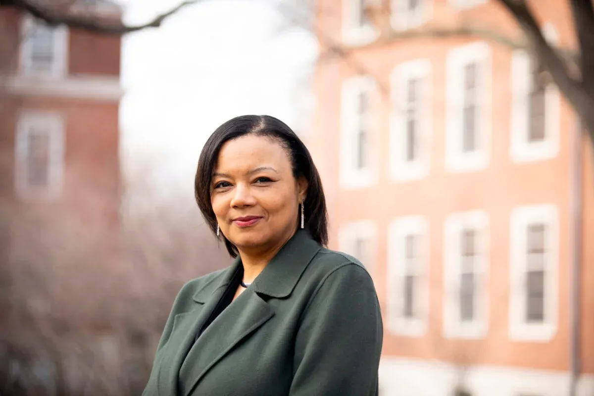 Dean Tomiko Brown-Nagin standing in front of Harvard building