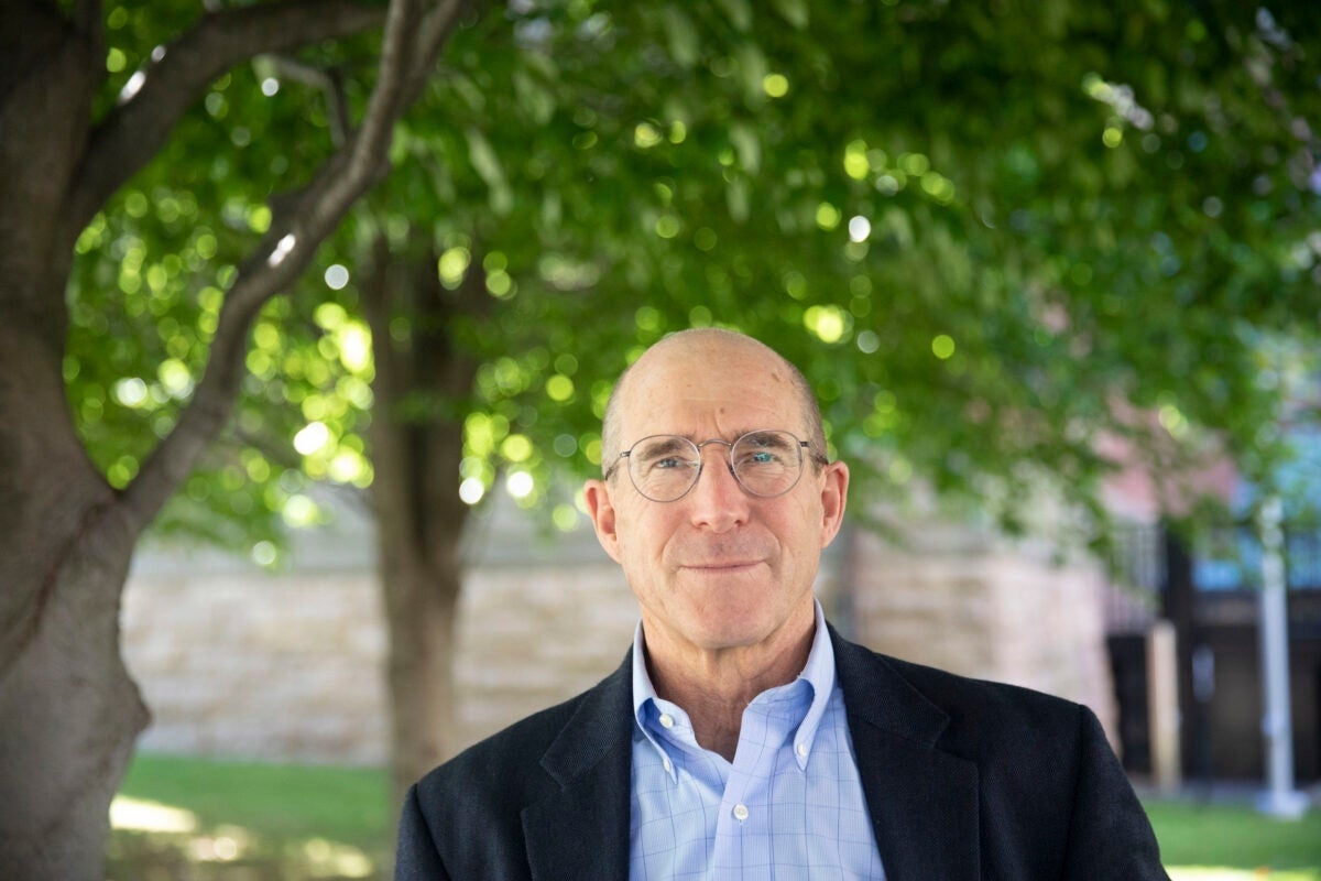 Vice Provost James Stock outside in front of trees