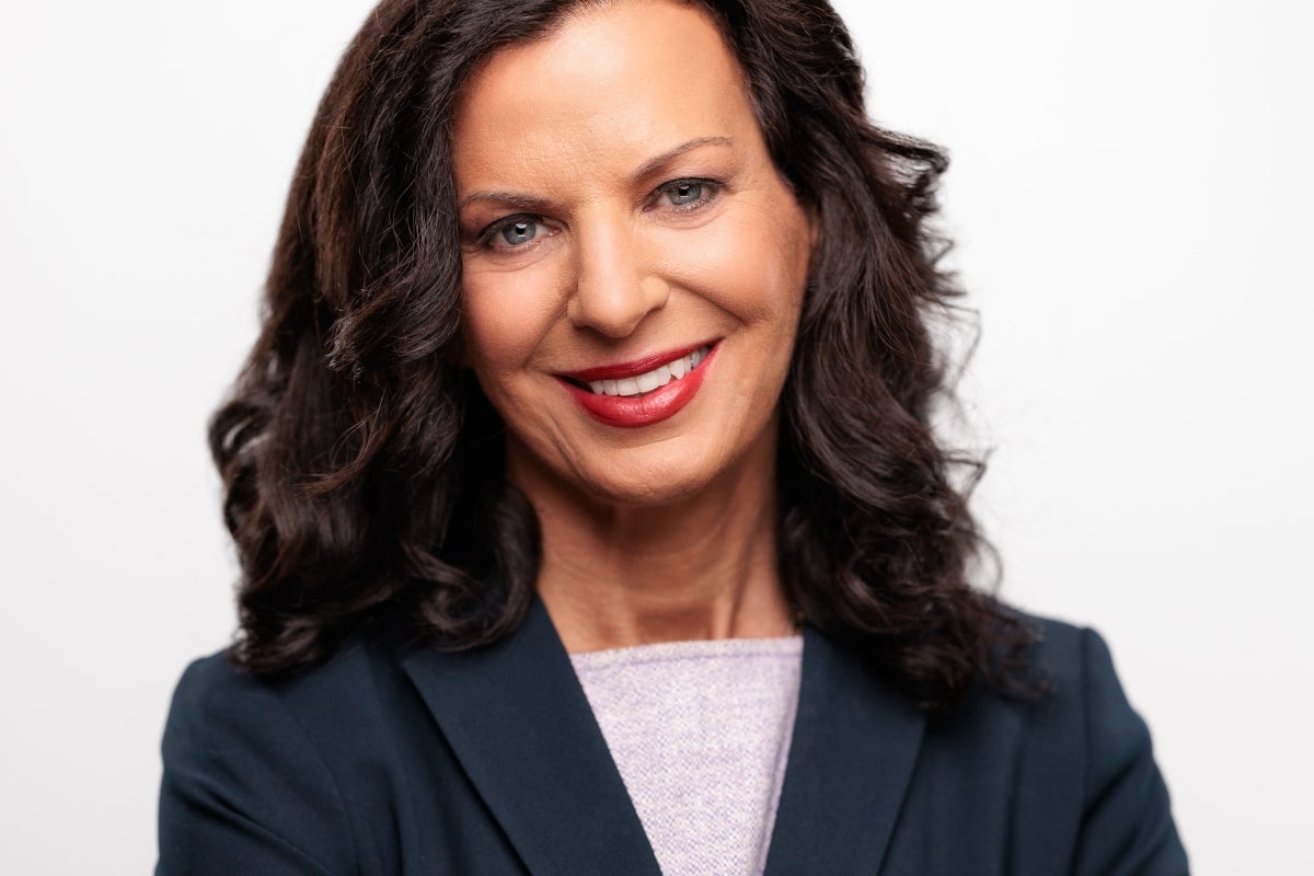 Juliette Kayyem smiling at camera in blazer