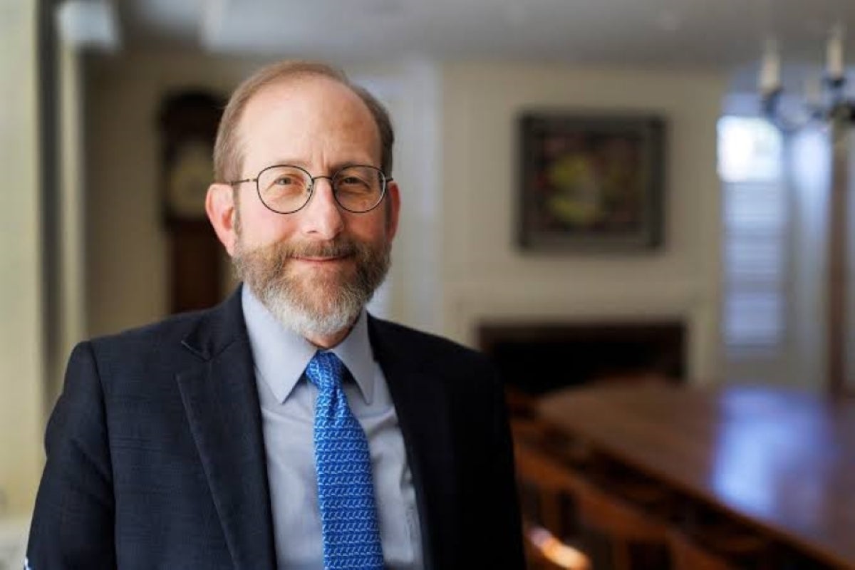 President Garber smiling in his office in Mass Hall