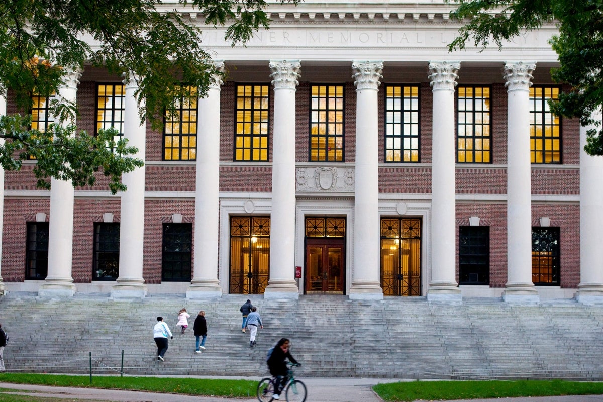 Front view of Widener Library with visitors walking up the steps