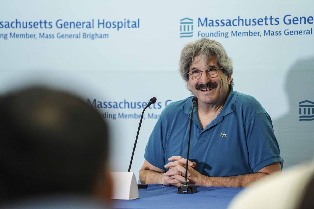 Gary Ruvkun PhD '82 smiles at a press conference