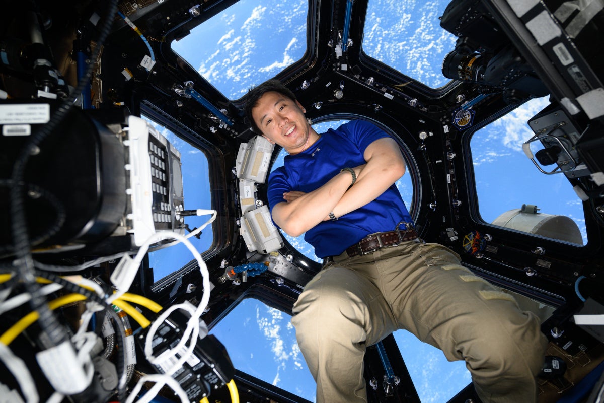 NASA astronaut and Expedition 73 Flight Engineer Jonny Kim poses for a portrait inside the cupola, the International Space Station's "window to the world.