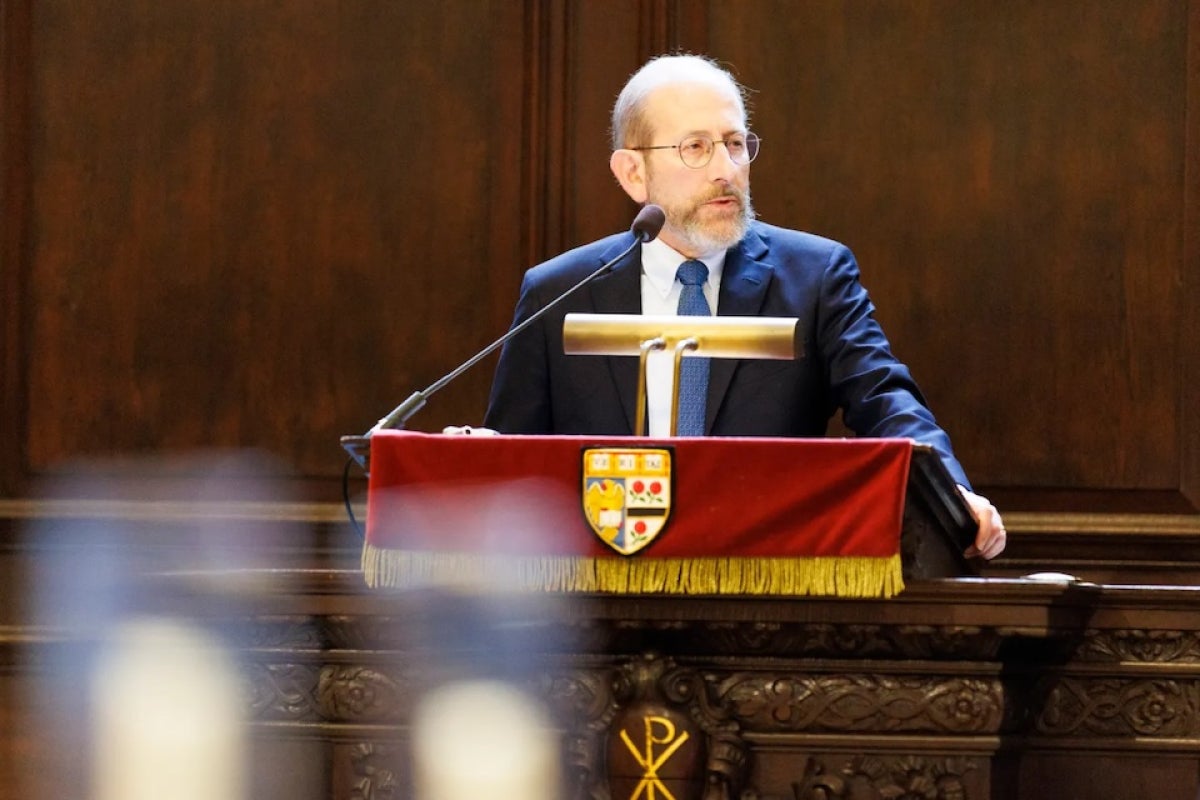 Alan Garber speaks at a podium in Memorial Church