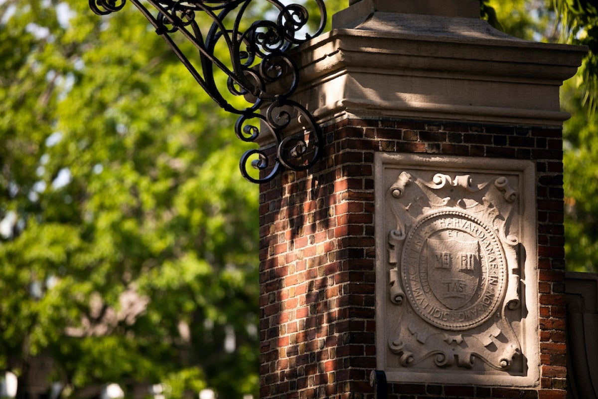 Veritas shield on a gate in Harvard Yard