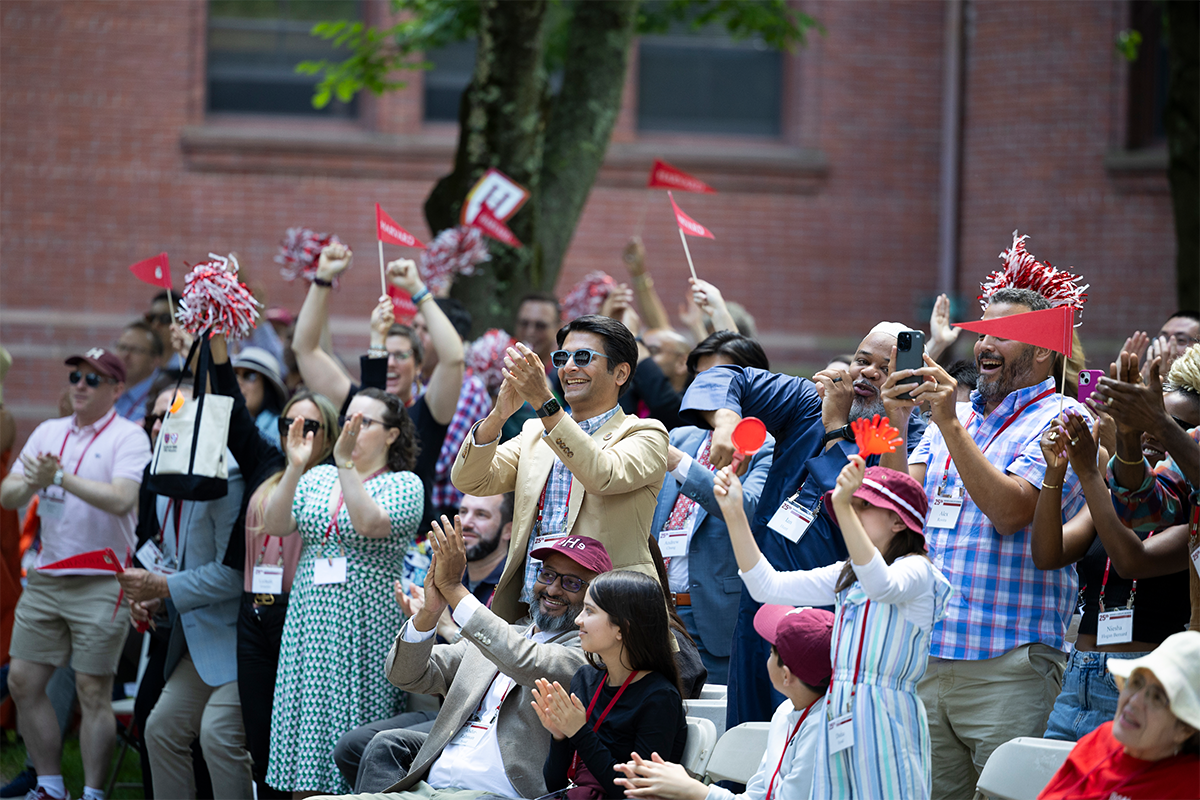 Alumni clapping during the 2024 Harvard Alumni Day main program