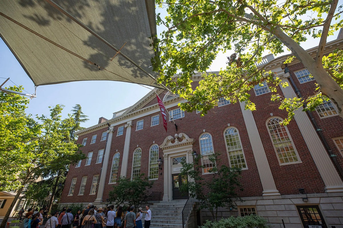 Lehman Hall with a group of people standing in front