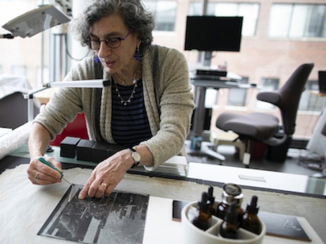 Helen H. Glaser Conservator Debora Mayer prepares collections for treatment using high-resolution, digitally scanned images