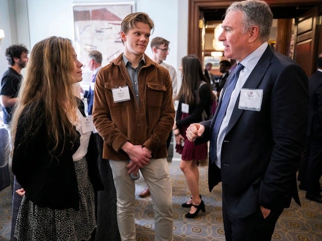 Kenneth C. Griffin speaks with students Naomi Bashkansky and David Paquette