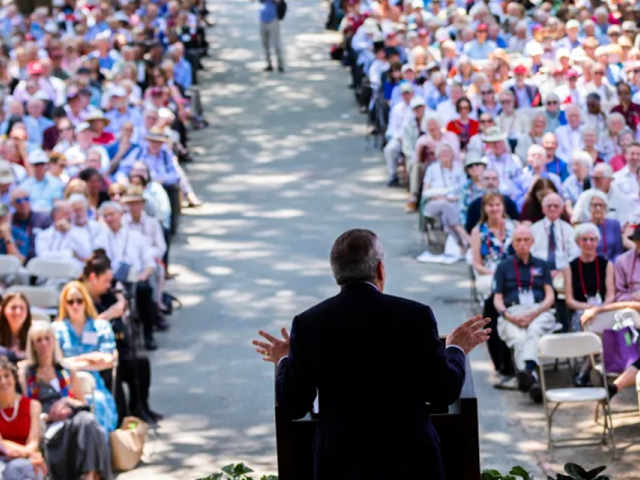 President Larry Bacow giving Harvard Alumni Day address