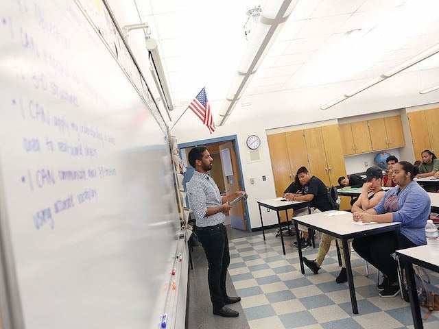 A student from the Harvard Teacher Fellows program teaches a class at Chelsea High School in Chelsea, Massachusetts.