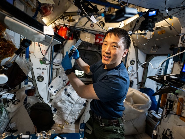 Jonny Kim conducts research operations for the Voyager DNA Decryption experiment taking place inside the International Space Station's Harmony module