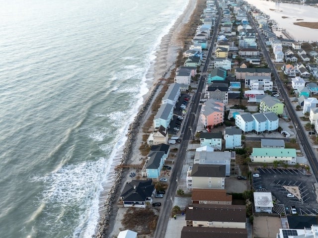 Aerial view of homes along a shoreline