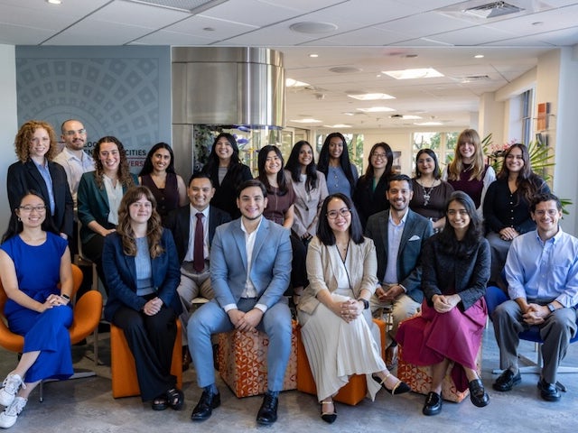 Bloomberg Harvard City Hall Fellows pose for a group photo inside the Bloomberg Center for Cities at Harvard University