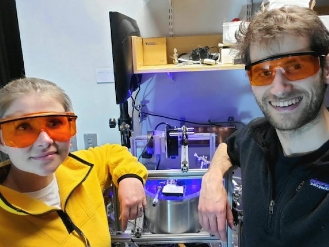 Rarefied Co-Founders Angela Feldhaus and Ben Schafer wear protective eye wear in a lab