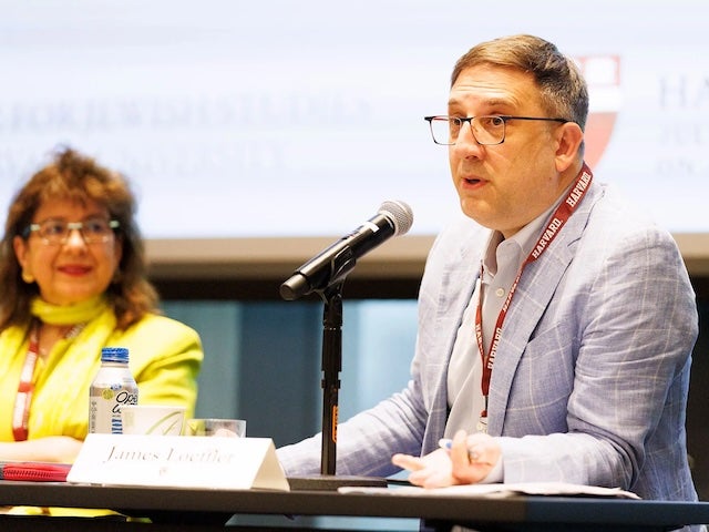 James Loeffler speaks into a microphone