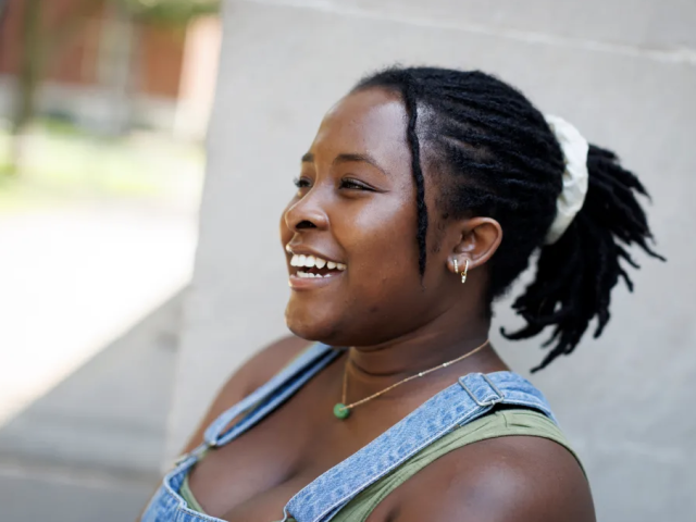 Undergraduate Dara Omoloja standing in Harvard Yard