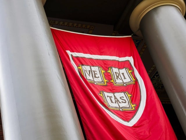 Two columns with the Veritas crimson banner in between. 