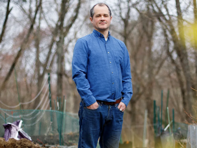 Dustin Tingley in his yard